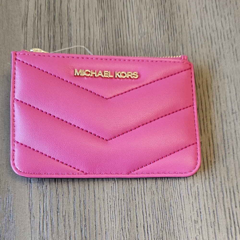 Michael Kors pink coin pouch wallet with ID. (4) pockets to put your cards.